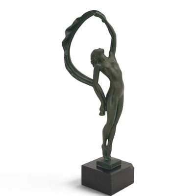 statue of a man holding a circle in his hands