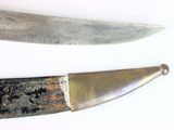 two knives that are sitting next to each other on a table