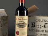 a bottle of wine sitting next to a box of wine