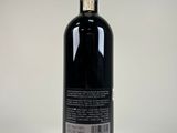 a bottle of wine that is sitting on a table