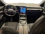 the interior of a car with a steering wheel, dashboard, and display screen