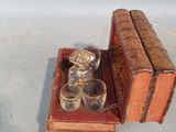 an old book and a glass on a table
