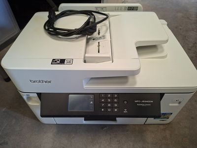 a printer that is sitting on top of a table