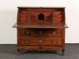 a small wooden desk with a drawer on top of it