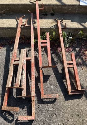 several pieces of wood are sitting on the ground next to the steps