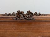 a close up of a carved wood object on a table