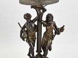 an image of a lamp that has a statue on top of it