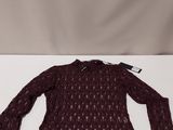 a woman ' s sweater with a long sleeves and a lace pattern