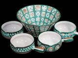 five bowls and a bowl on a black background