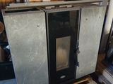 an image of a stove in a garage with a pallet