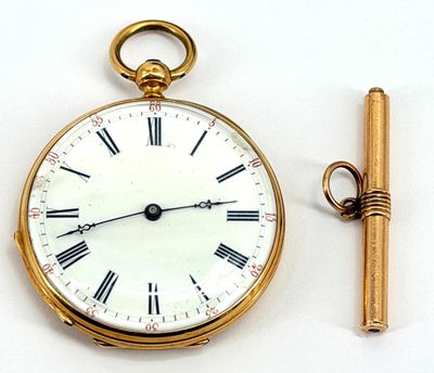 a gold pocket watch with roman numerals and a key