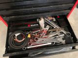 a tool box with tools inside of it on the floor