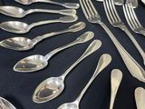 a lot of spoons and spoon spoons on a table