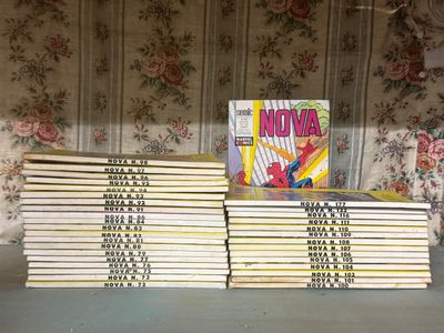 many books stacked on top of each other on a table