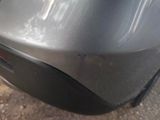a close up of a car ' s rear bumper