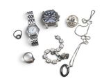 many different types of jewelry on a white surface