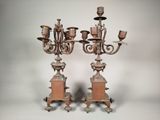 pair of antique cast iron candelabs on pedestals