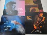 quatre albums d'Elvis Presley et de son groupe, dont les Beatles