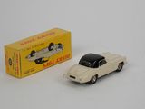 a toy car that is sitting next to a box