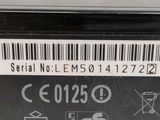 a close up of the back of a laptop with a bar code on it