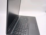 a laptop that is sitting on a white table