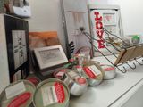 many cans of food sitting on a counter in a store