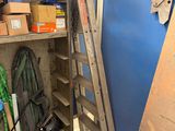 a ladder leaning up against a wall in a garage