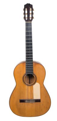 une image représentant une guitare posée sur une surface blanche