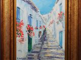 an oil painting of a narrow street with flowers in a gold frame