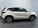 a picture of a white suv parked in a room