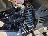 a close up of the front suspension of a motorcycle