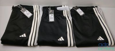 three pairs of black and white adidas pants with tags on them