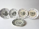 five plates and a plate with a picture of a man on a horse