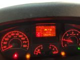 a car dashboard with various gauges and numbers on it