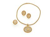 a gold and mother of pearl necklace and earring set