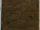 an old wooden box on a white wall with a white wall in the background