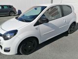 a picture of a small white car parked in a parking lot