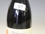 a bottle of wine that is sitting on a table