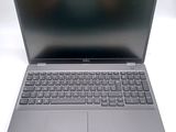 an open laptop computer sitting on top of a white table