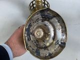 a person that is holding a metal object in their hand