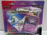 a close up of a package of pokemon cards on a white surface