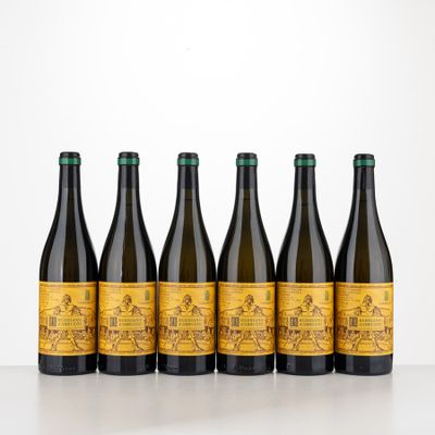 six bottles of wine are lined up on a table