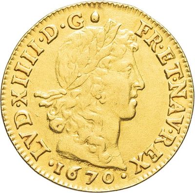 a close up of a gold coin with a woman ' s head on it