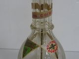 a glass vase with toothbrushes in it on a table