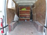 a white van with shelves in the back of it