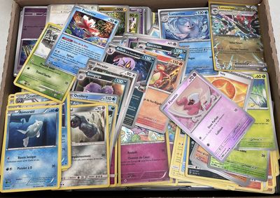 a box full of pokemon cards sitting on top of a table
