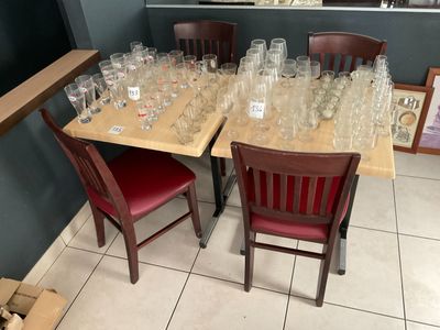 many empty wine glasses on the table in the room