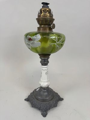 an image of a green and white lamp with a bird on it