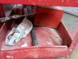 a red box with a pair of white shoes in it