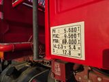 a red truck with a number plate on the side